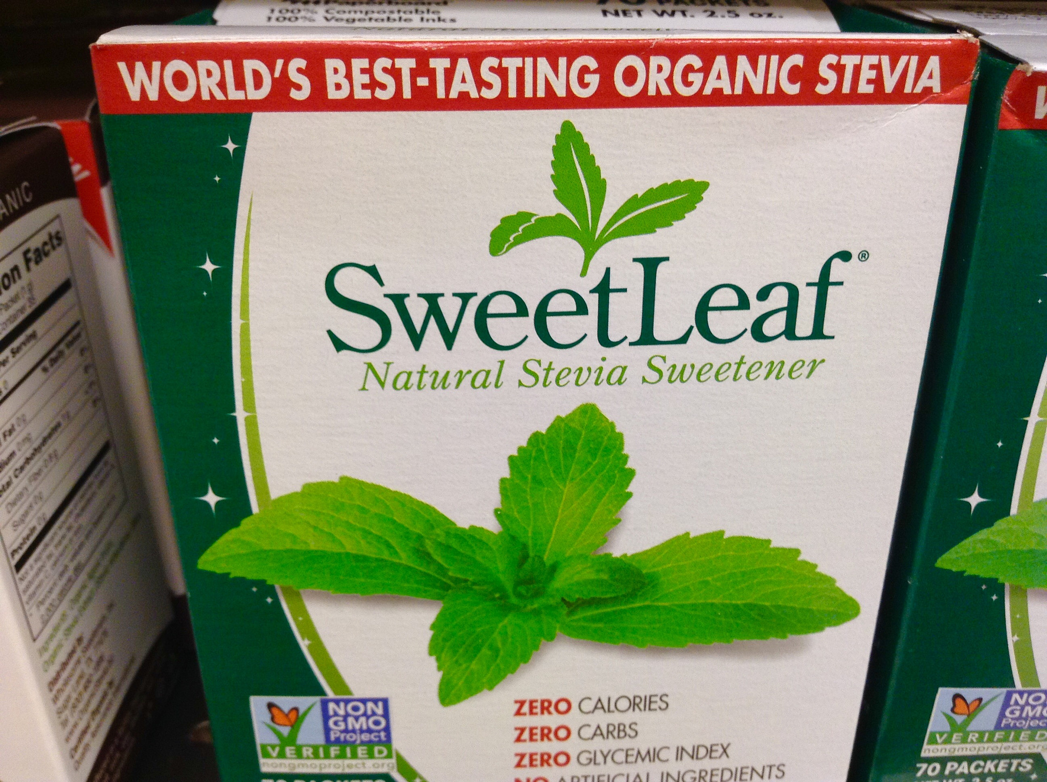Photo shows a box of SweetLeaf stevia sweetener, with front-of-package labels "world's best-tasting organic stevia," "Natural Stevia Sweetener," "ZERO calories, ZERO carbs, ZERO glycemic index," as well as a Non-GMO Project l
