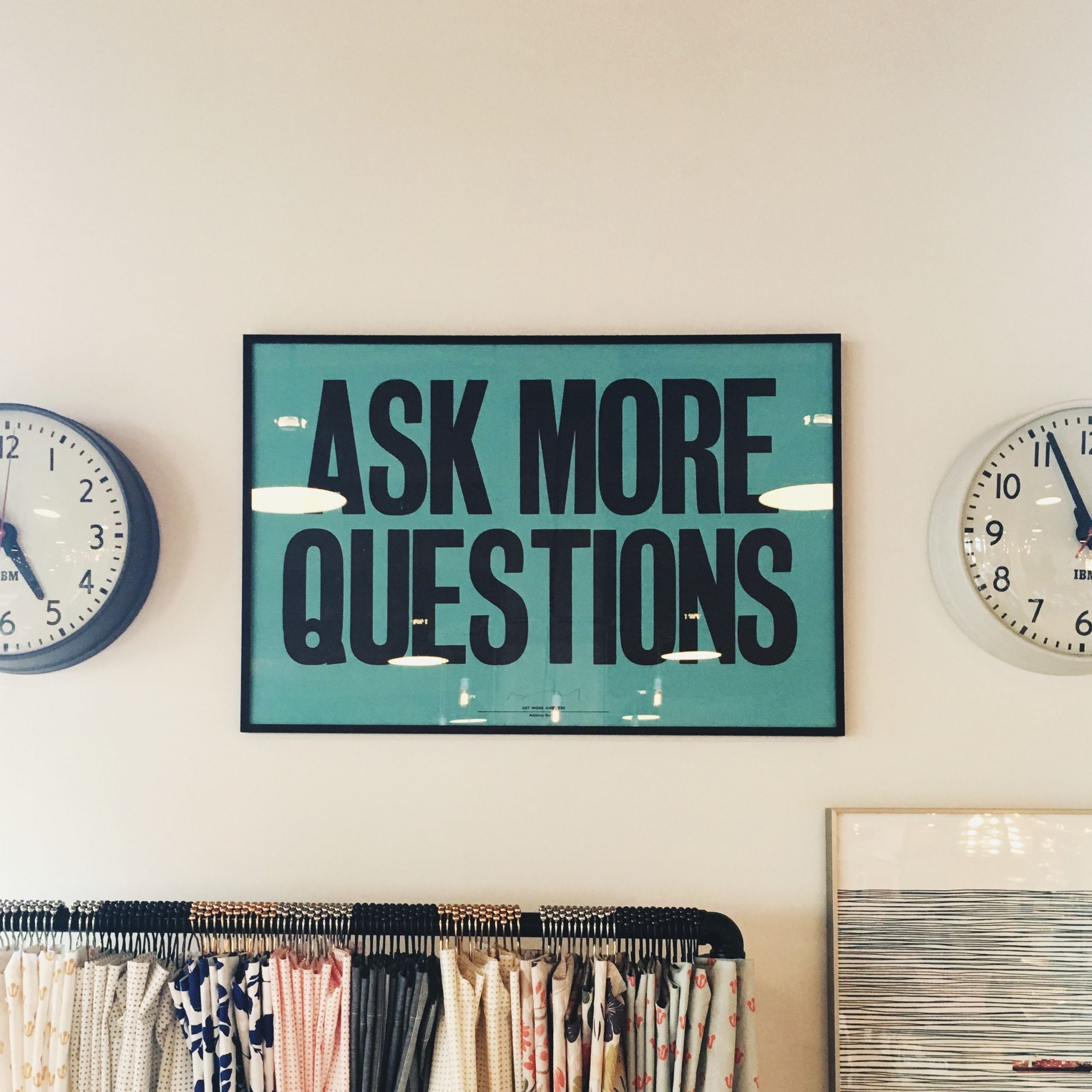Ask more questions signage