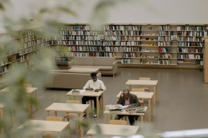 image of library with books and students at desks